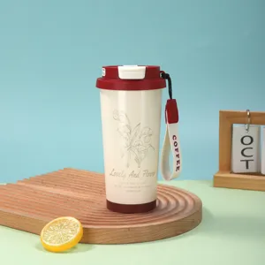 Mug à café en acier inoxydable avec motif de muguet et lanière portable pour un usage quotidien.
