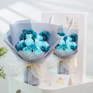 Blue soap rose bouquet with baby's breath and gift bag for romantic Valentine's Day gifts.