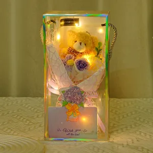 Detail of teddy bear knitted flower bouquet in a clear gift box with LED lights