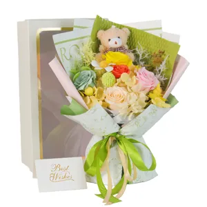 Colorful soap flower bouquet featuring a cute plush teddy bear, white gift box and card.