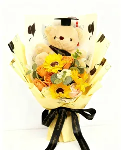 Details of the graduation bear sunflower soap flower bouquet with elegant ribbon wrapping.