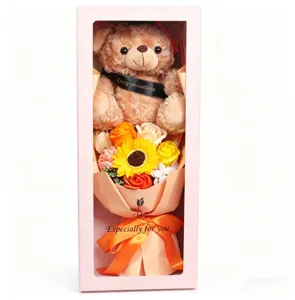 Closeup of the cute graduation plush bear and colorful soap flower bouquet inside gift box.