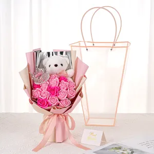 Pink soap rose bouquet with plush teddy bear, small crown, and clear plastic gift bag