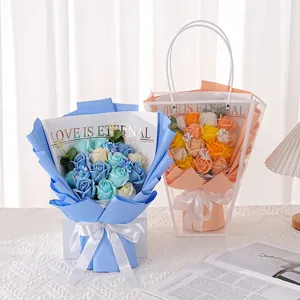Detailed view of blue and orange soap flower bouquets with 'Love is Eternal' text.