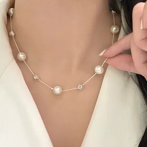 Detailed view of elegant pearl and starry bead necklace worn on neck for women