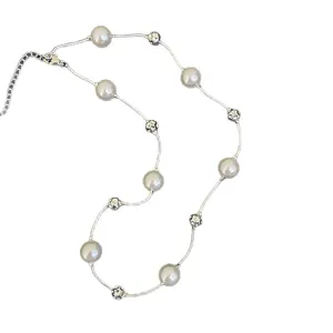 Elegant silver pearl necklace with starry sky design on white background