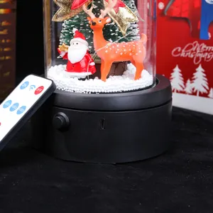 Detailed macro shot of the Christmas snow globe base showing USB port and remote