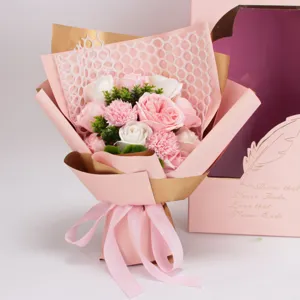 Detailed close-up of pink and white soap rose flowers bouquet with elegant gift box packaging.