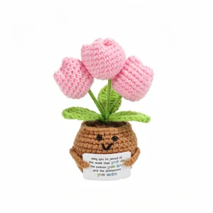Handmade crochet pink tulip potted plant with positive quote card, cute desk decor detail.