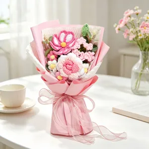 Detailed view of handmade crochet flower bouquet with pink roses and cosmos