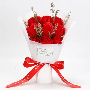 Close-up of a 9-rose red soap flower bouquet with elegant white wrapping and red ribbon.