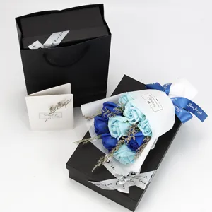 Elegant gift set with nine blue soap roses bouquet in a black box and matching bag