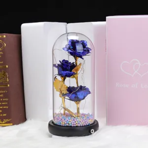 LED glass dome rose gift with three blue artificial flowers, perfect for Valentine's Day decor.