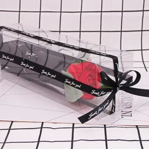 Close-up of red soap rose in clear PVC gift box with Just for you ribbon decoration