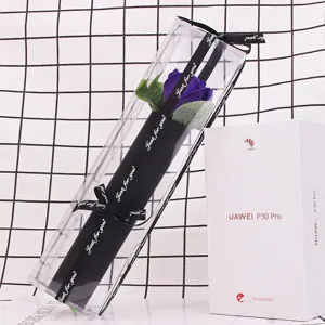 Detailed view of a single purple soap rose in a long PVC box with a black ribbon