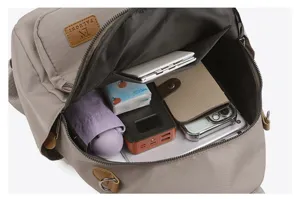 Detailed view of the open grey casual backpack interior showing spacious multi-compartment storage.