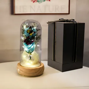 Rose éternelle bleue dans un dôme en verre LED avec un emballage cadeau de luxe