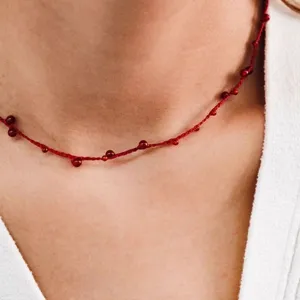 Hand-woven red string necklace with delicate red agate beads for luck