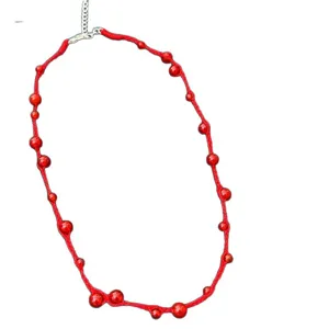 Hand-woven red rope necklace featuring polished agate beads and adjustable clasp