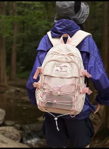 Functional pink large capacity backpack for hiking with mesh pocket and heart details