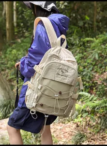 Close-up detail of a large capacity beige outdoor backpack for students and hiking