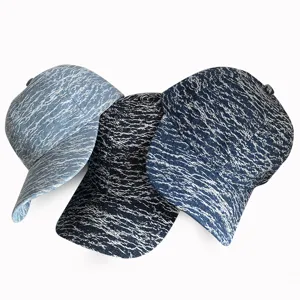 Vintage washed denim baseball cap detail shot, showing unique marbled pattern and casual brim style.