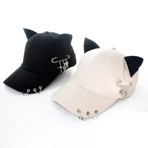 Street style baseball cap with cute cat ears, metal rings and safety pin decor.