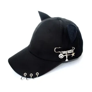 Metal ring decoration and pin detail on black cat ear baseball cap, street hip-hop style