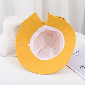 Vue détaillée du chapeau bob jaune avec nœud fendu pour femme, protection solaire élégante