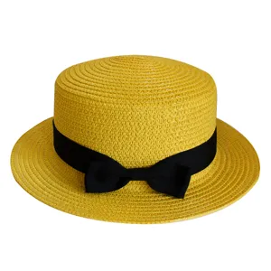 Detailed view of yellow woven straw hat featuring classic black ribbon bow for summer sunshade.