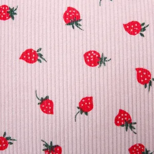 Detailed close-up showing the pink ribbed texture and cute strawberry pattern of the backpack fabric