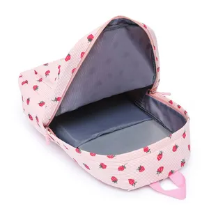 Detailed macro view showing the spacious internal compartment of this pink strawberry backpack.