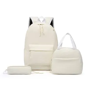 Minimalist three-piece off-white corduroy backpack set with tote bag and pencil case