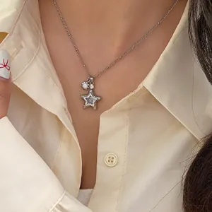 Detailed view of an elegant star pendant necklace featuring micro-paved zircon stones