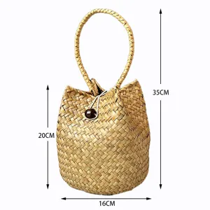 Handmade seagrass woven bucket bag with dimensions: 35cm total height and 16cm width