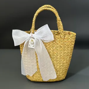 Handwoven straw storage basket with white sheer bow pastoral style wedding gift basket