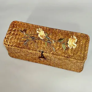 Handmade seagrass storage box with lid and elegant embroidered floral pattern details