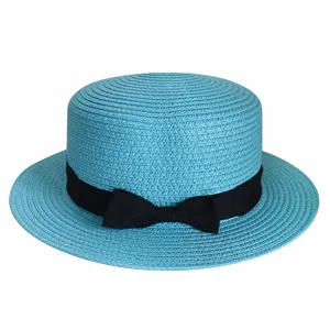 Light blue flat top straw hat detail, featuring a stylish black ribbon bow and breathable weave.