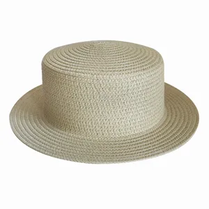 Detailed view of a beige straw boater hat featuring a flat top design and wide brim for summer.