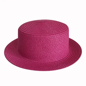 Magenta flat top straw hat detail, breathable woven material for summer beach and outdoor sun protection.