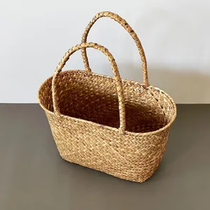 Handmade natural seagrass woven storage basket with dual handles and rustic texture