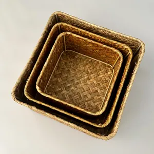Handmade woven storage basket detail, natural straw material with sturdy metal frame support.