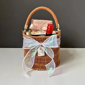 Round wicker gift basket with elegant bow for wedding bridesmaid party, straw woven tote box.