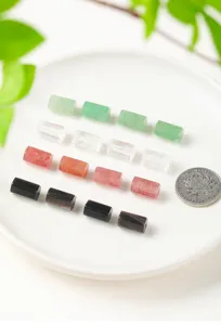 Close-up detail of hexagonal natural crystal pillar beads for DIY jewelry making