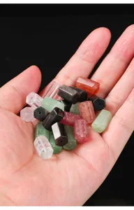 Detailed view of natural crystal hexagonal beads including strawberry and clear quartz
