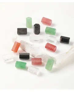 Detailed shot of natural hexagonal crystal beads in varied colors for DIY jewelry making