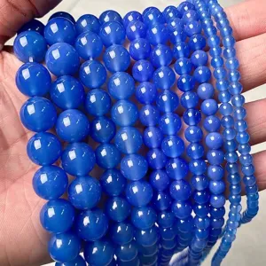 Close-up of blue translucent agate beads in various sizes for DIY jewelry making