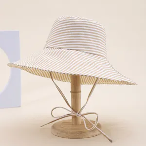 Striped wide-brim bucket hat for women, foldable beach sun protection hat with chin strap.