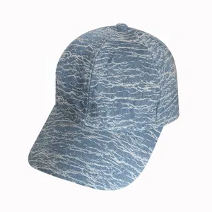 Detail view of a retro washed denim baseball cap showcasing texture and curved brim design.