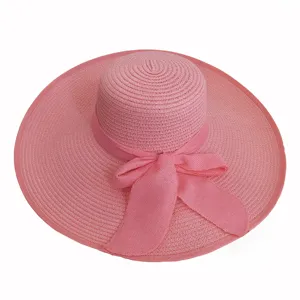 Wide-brim pink straw sun hat with elegant ribbon bow for women's summer beach travel